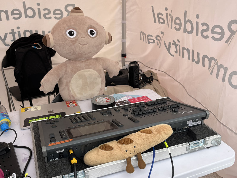 Barry the Baguette and Makka Pakka operating the Arrivals Stage lighting desk